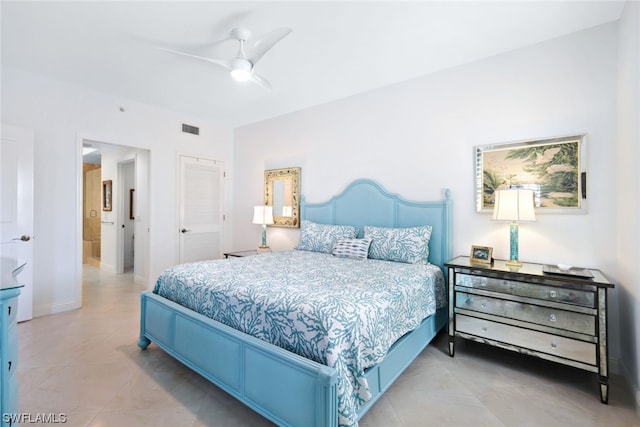 bedroom with light tile flooring and ceiling fan