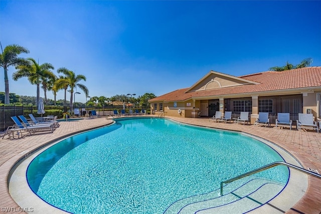 view of swimming pool with a patio area