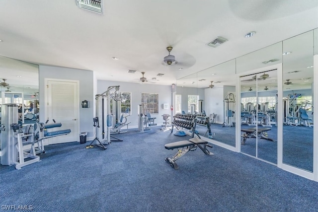 workout area featuring dark carpet and ceiling fan