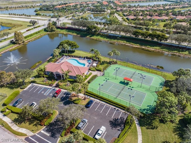 birds eye view of property with a water view