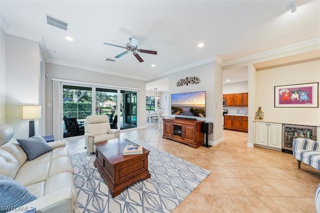 living room with crown molding, ceiling fan, light tile floors, and beverage cooler