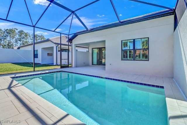 view of swimming pool with a lanai and a patio