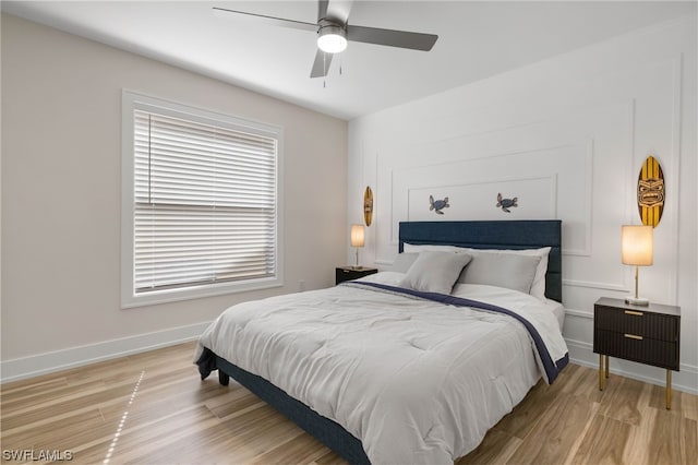 bedroom featuring ceiling fan and light hardwood / wood-style flooring