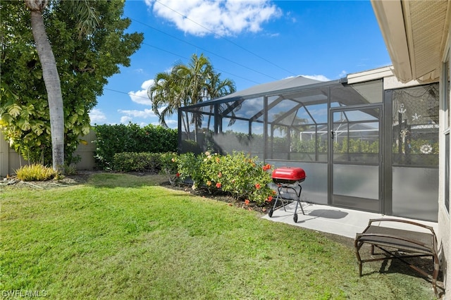 view of yard featuring a patio and glass enclosure