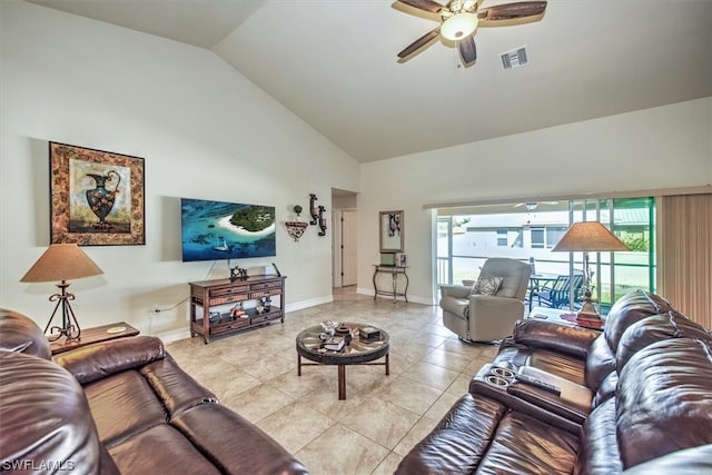 tiled living room featuring ceiling fan, plenty of natural light, and lofted ceiling