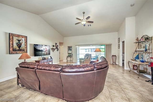 living room featuring ceiling fan, light tile patterned flooring, and lofted ceiling