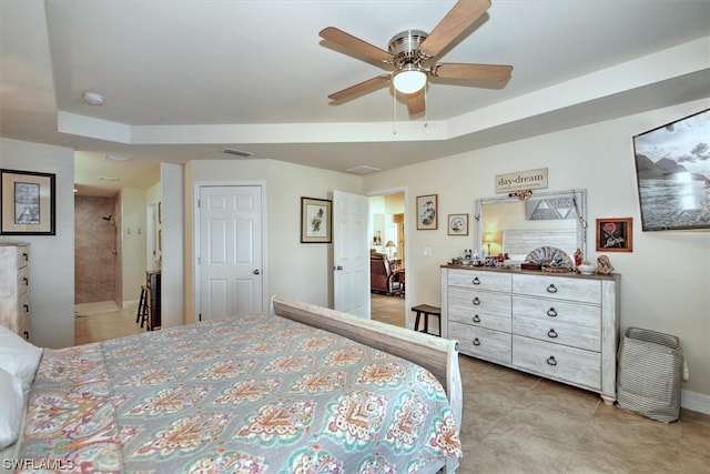 bedroom with ceiling fan and connected bathroom