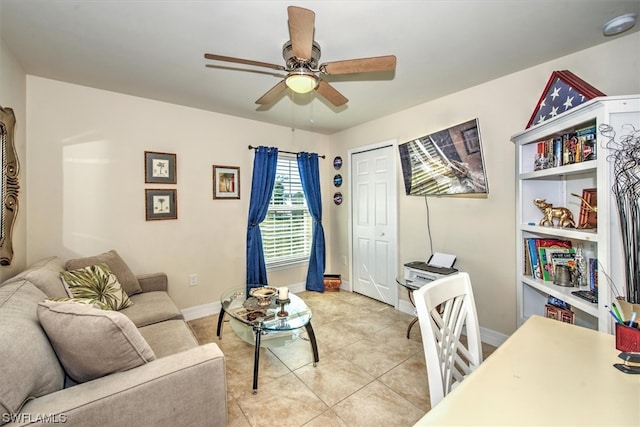 tiled living room with ceiling fan