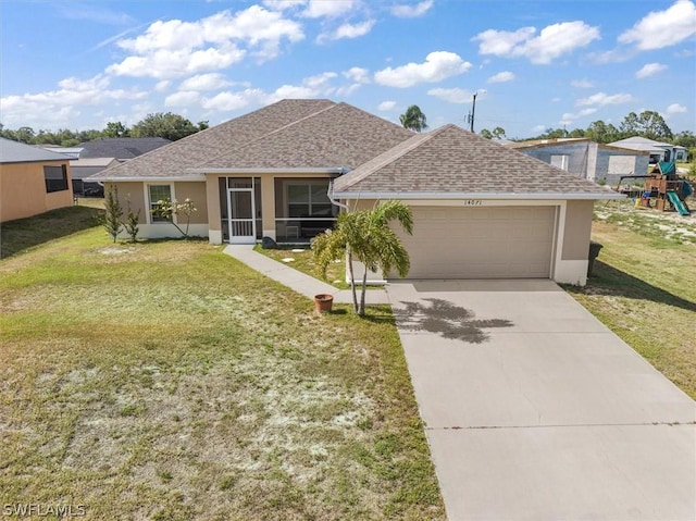 ranch-style house featuring a garage and a front lawn