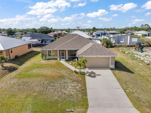 view of front of house featuring a front yard and a garage