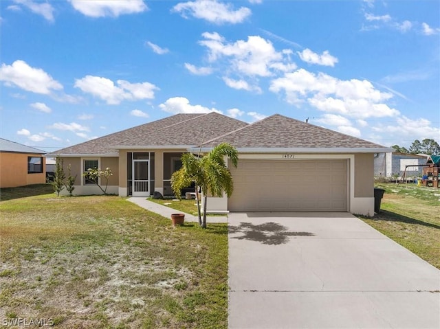 single story home with a sunroom, a garage, and a front yard