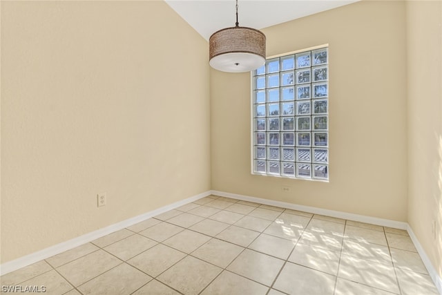 spare room with light tile floors