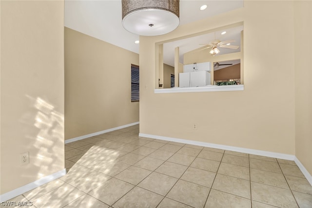 unfurnished room featuring light tile flooring and ceiling fan