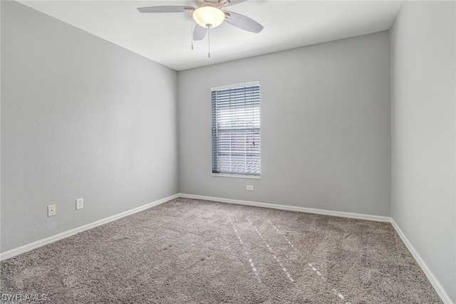 empty room with ceiling fan and carpet