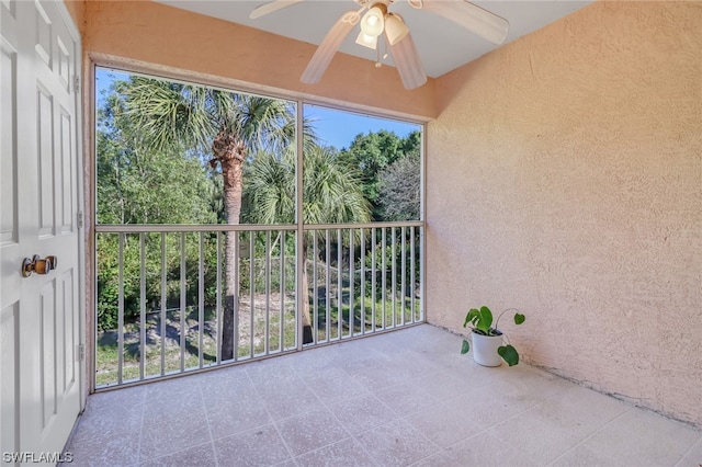 exterior space featuring ceiling fan