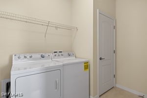 laundry area with separate washer and dryer