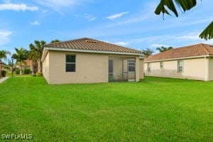 back of house with a yard