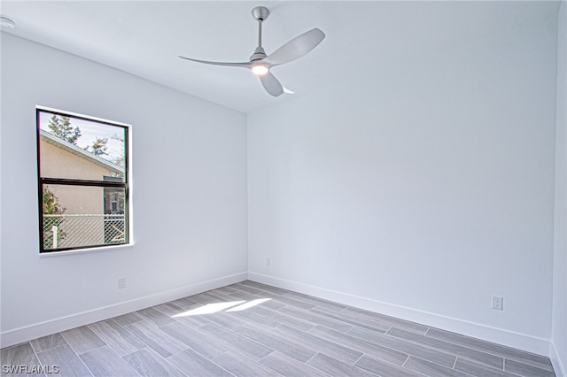 empty room featuring light hardwood / wood-style floors and ceiling fan