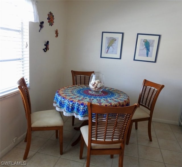 dining area with light tile patterned floors