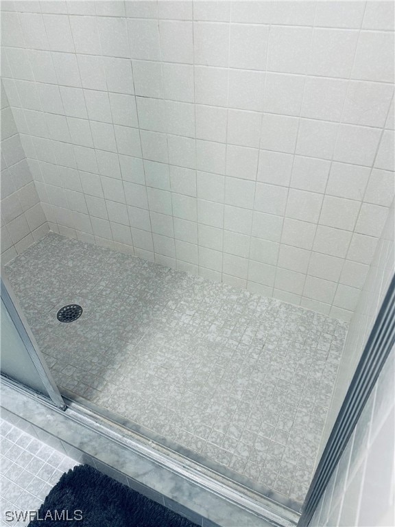 interior space featuring a tile shower