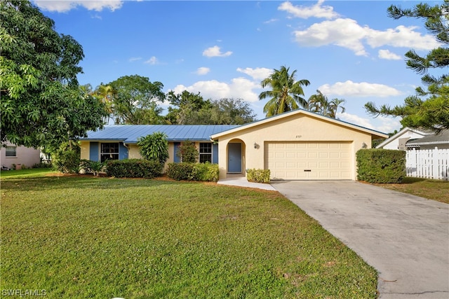 ranch-style home featuring a front lawn and a garage