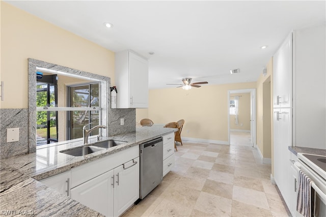 kitchen featuring light tile flooring, tasteful backsplash, white cabinetry, dishwasher, and sink