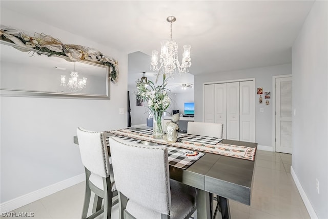 dining area with a chandelier and light tile patterned floors