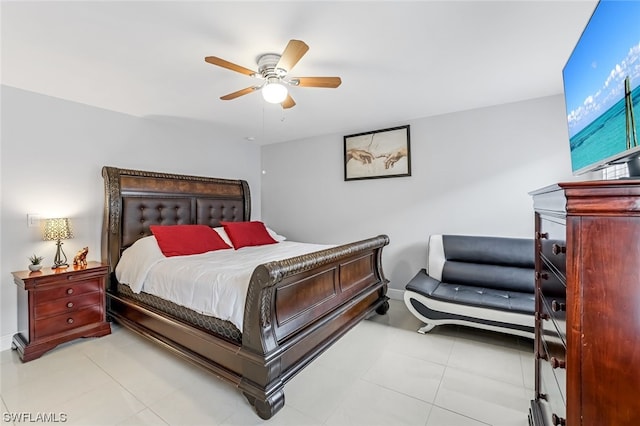 tiled bedroom featuring ceiling fan