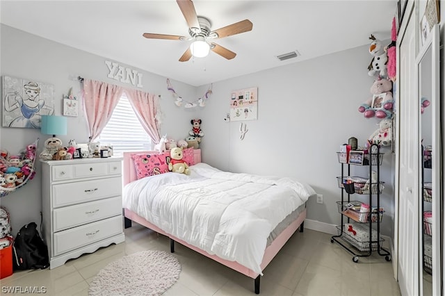 bedroom featuring light tile patterned flooring and ceiling fan