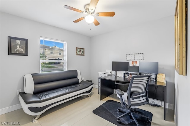 home office featuring light tile patterned floors and ceiling fan