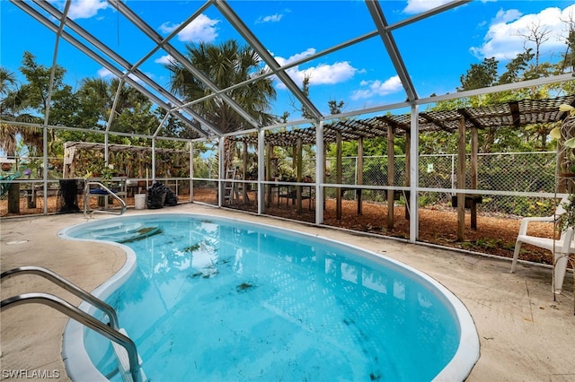 view of pool featuring a patio and a lanai