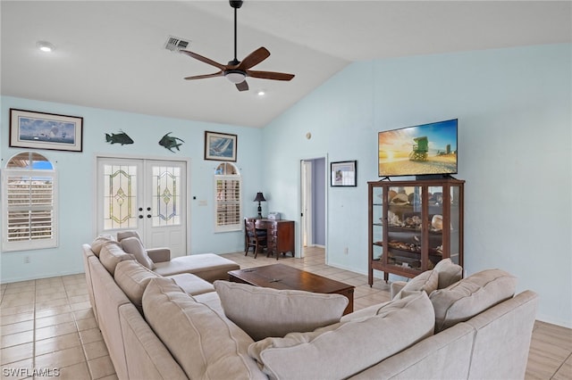 tiled living room featuring vaulted ceiling, french doors, and ceiling fan