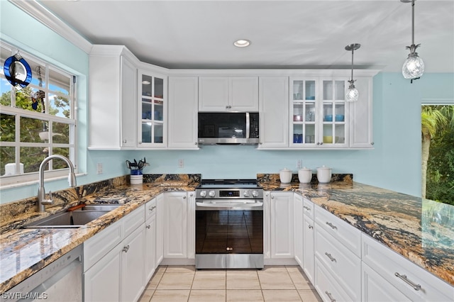 kitchen with sink, stainless steel appliances, and white cabinets