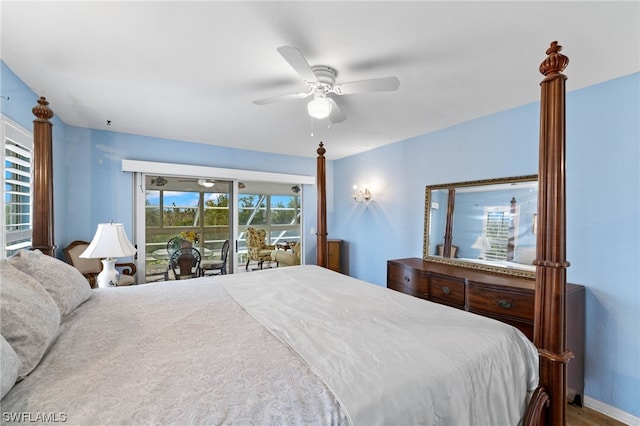 bedroom featuring multiple windows, access to exterior, and ceiling fan