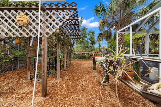 view of yard featuring glass enclosure