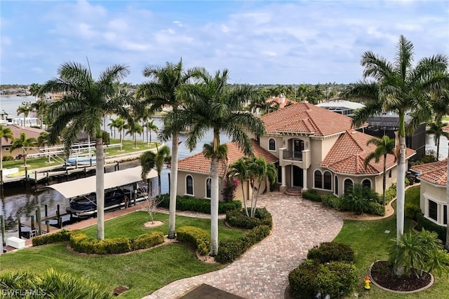 exterior space featuring a front lawn and a boat dock