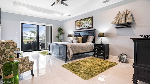 tiled bedroom with a raised ceiling, ornamental molding, ceiling fan, and access to outside