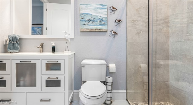 bathroom with vanity, toilet, and walk in shower