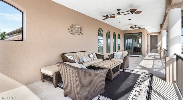 interior space featuring ceiling fan and a wealth of natural light