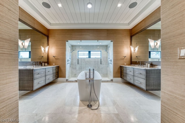 bathroom with an enclosed shower, beam ceiling, double sink vanity, and tile flooring