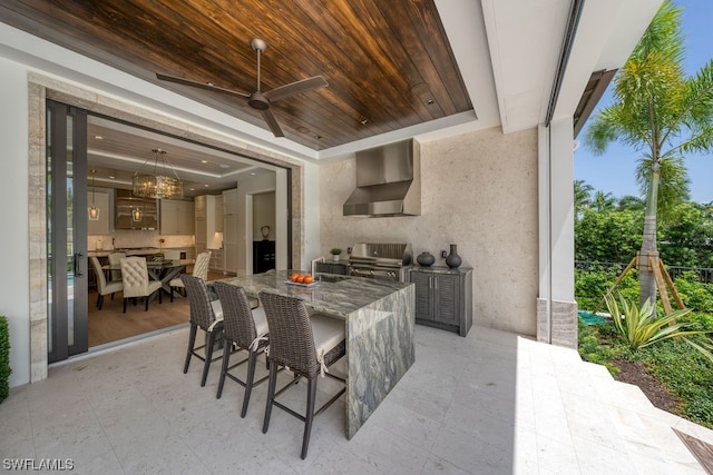 view of patio with area for grilling, grilling area, and ceiling fan