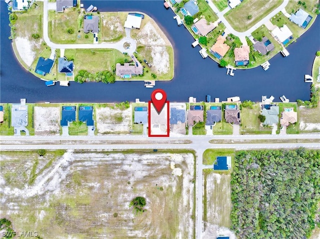 aerial view with a water view and a residential view