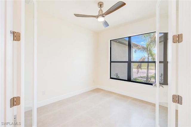 unfurnished room featuring ceiling fan and plenty of natural light