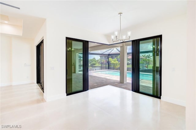 unfurnished room featuring a sunroom and baseboards