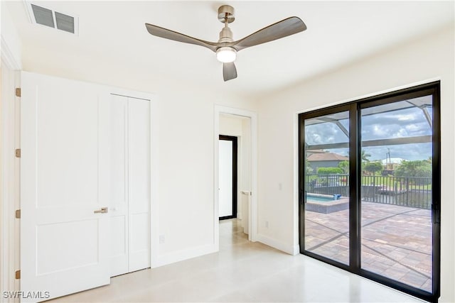 unfurnished bedroom featuring ceiling fan, a closet, and access to outside