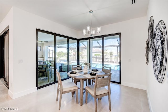 dining area with an inviting chandelier, visible vents, and baseboards