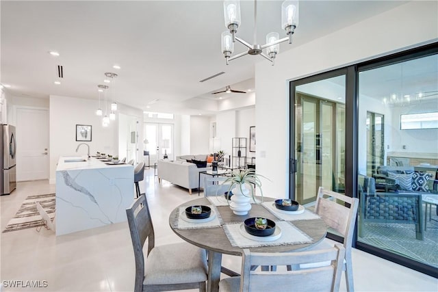 dining room featuring a chandelier, french doors, and recessed lighting