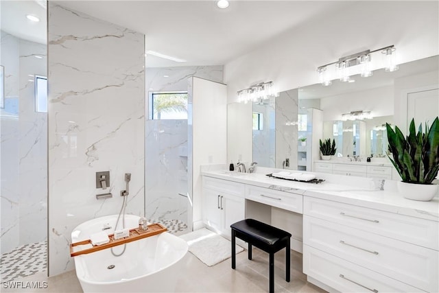 bathroom with recessed lighting, a soaking tub, vanity, and a marble finish shower