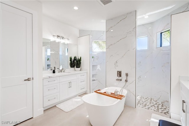 full bath with a marble finish shower, visible vents, a soaking tub, vanity, and recessed lighting