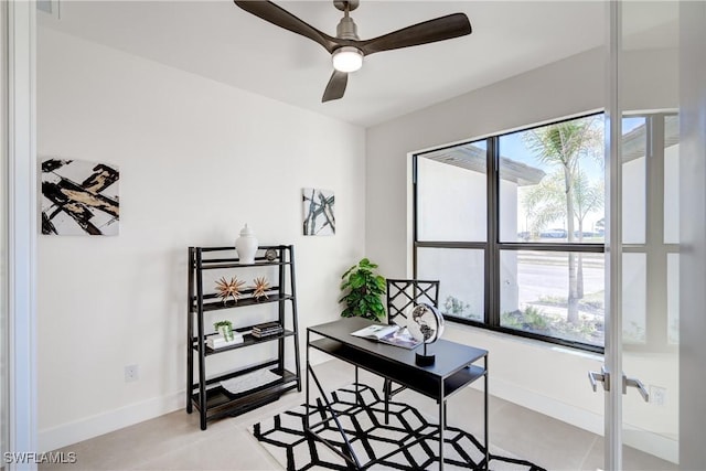 office space with plenty of natural light, baseboards, ceiling fan, and french doors